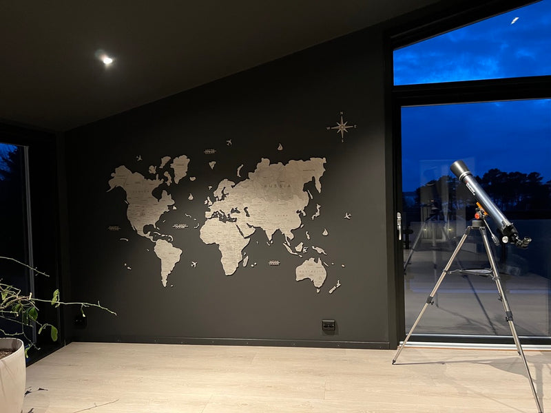 A GeoArte wooden world map in a customer's home